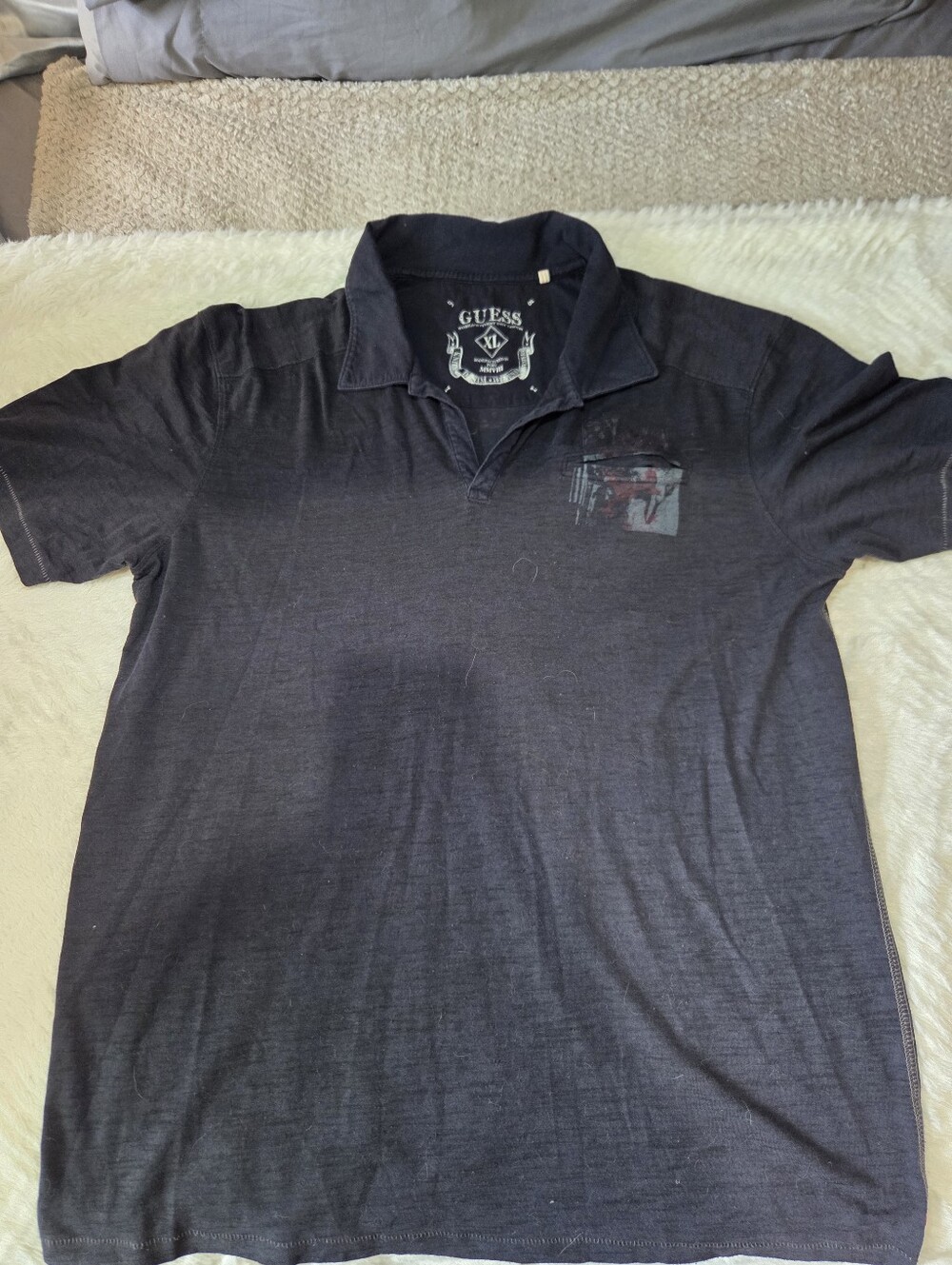 Guess Men’s Black Polo with Subtle Chest Graphic